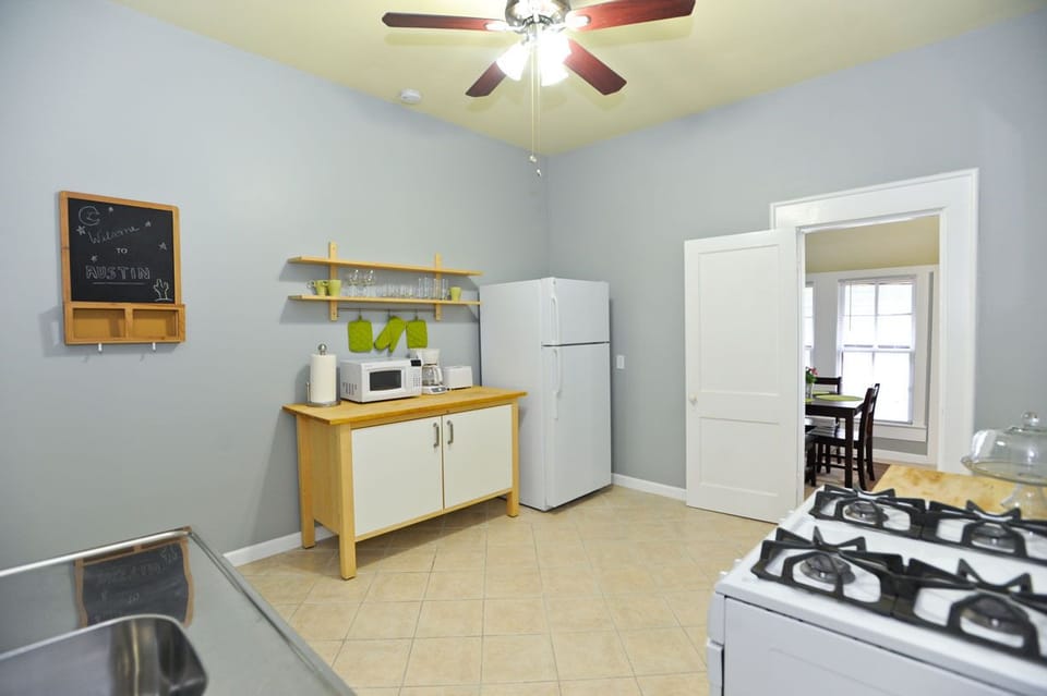 Kitchen with dining, pots, pans, plates