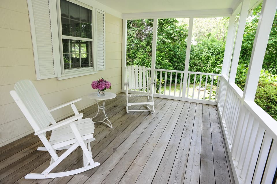 Relax with a cup of coffee or a tasty beverage on the covered front porch