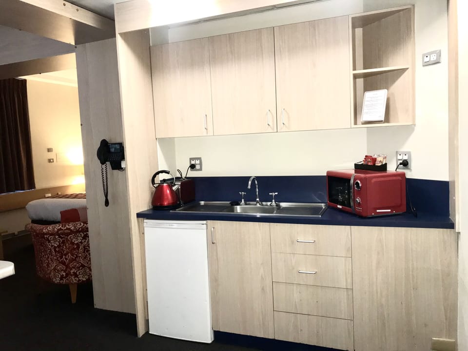 Family Room, Balcony | Private kitchenette | Fridge, coffee/tea maker, electric kettle