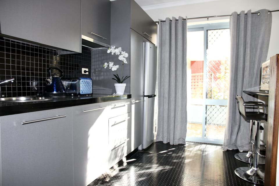 Family Room, Balcony | Private kitchenette | Fridge, coffee/tea maker, electric kettle