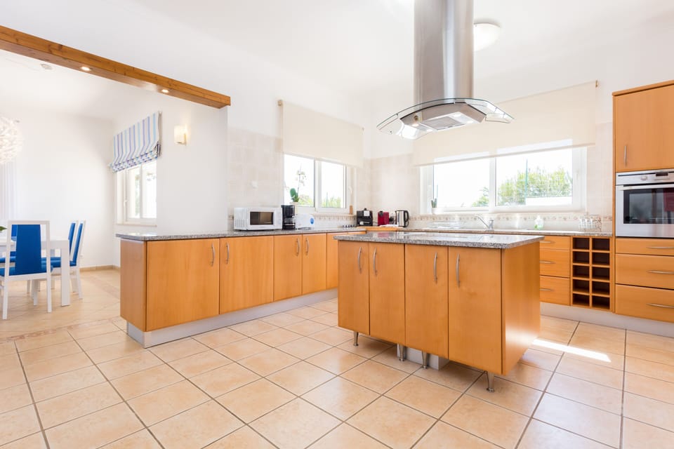 Bright kitchen with Nespresso machine, microwave, oven etc. 