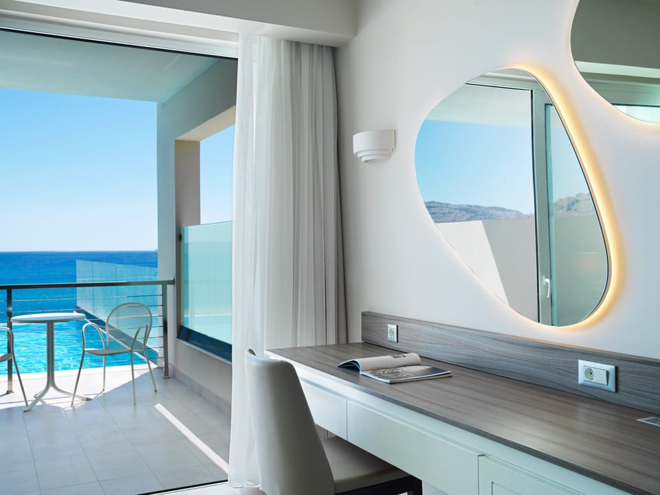 Family Room, Pool Access, Sea View (Executive) | Free minibar, in-room safe, desk, blackout drapes