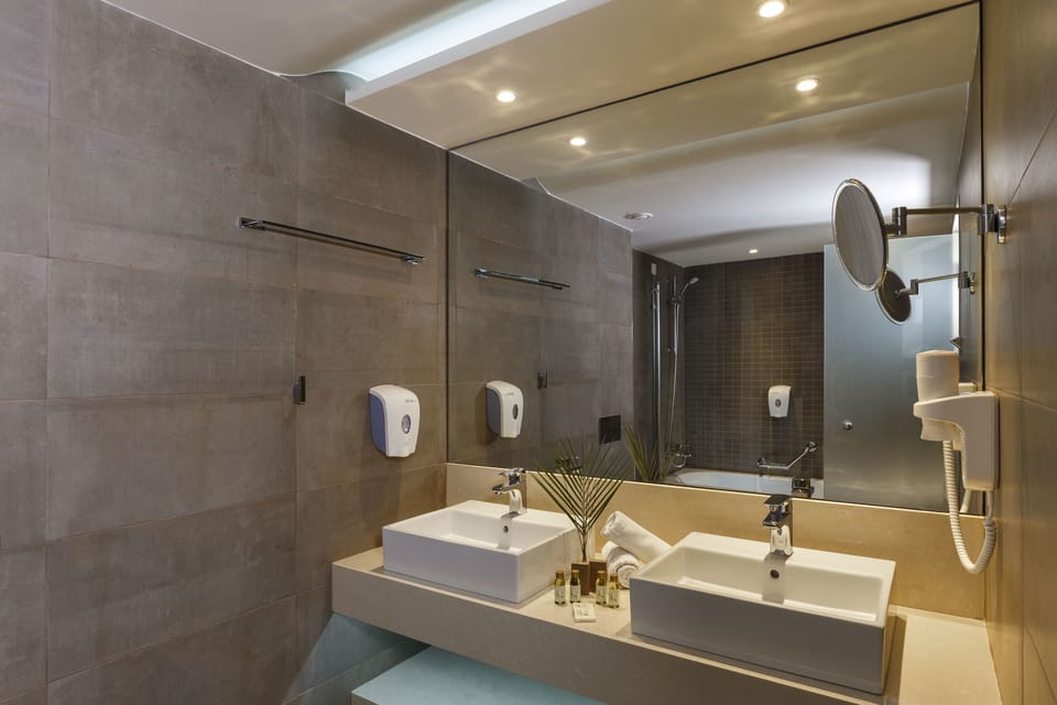 Shower, eco-friendly toiletries, hair dryer, towels