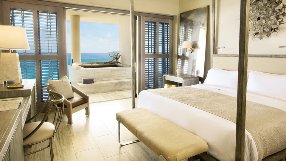 Premium bedding, down comforters, minibar, in-room safe