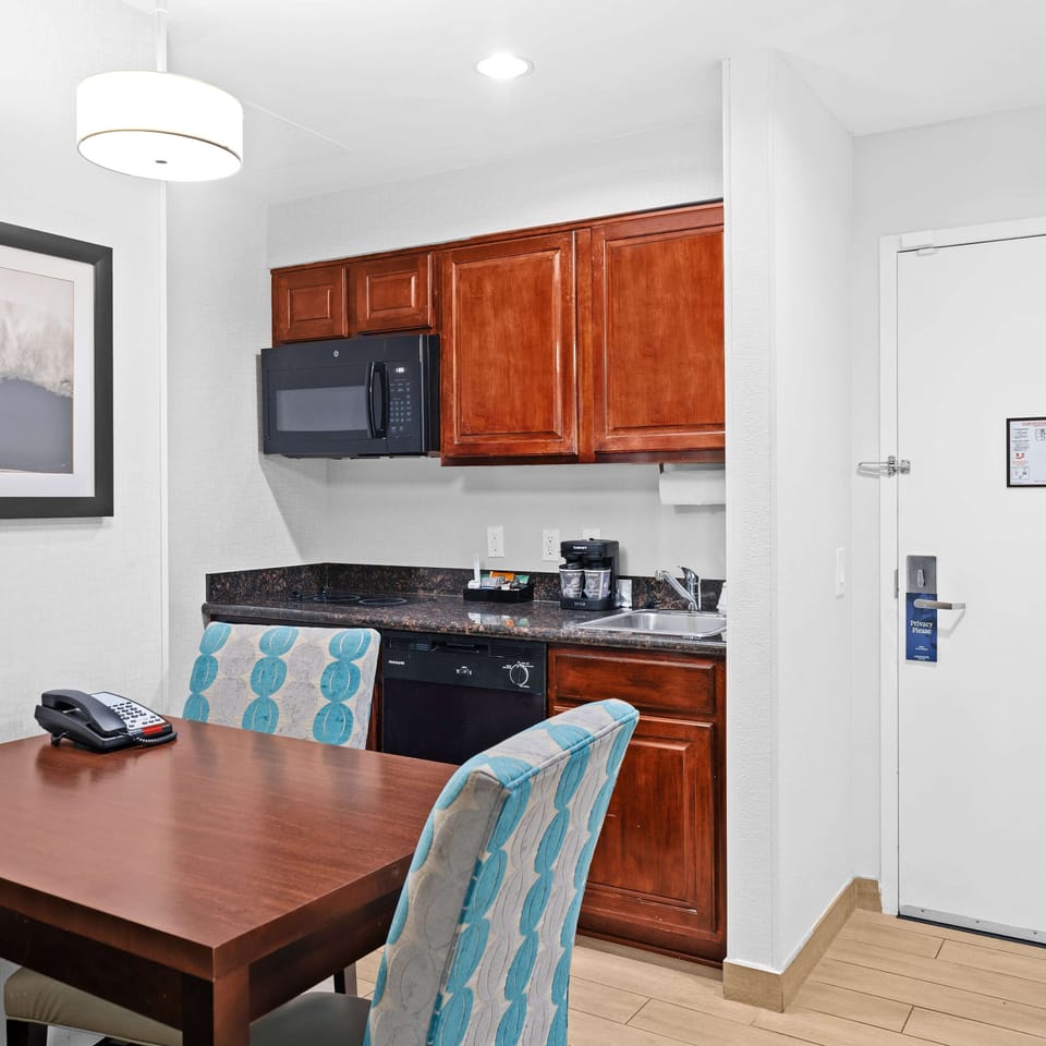 Suite, 1 King Bed | Private kitchen | Full-size fridge, microwave, coffee/tea maker, cookware/dishes/utensils