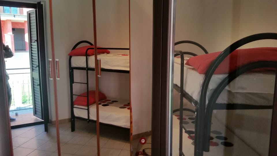 The 3rd Bedroom with twin bunks and large wardrobes & private balcony.