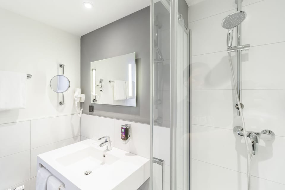 Shower, eco-friendly toiletries, hair dryer, towels