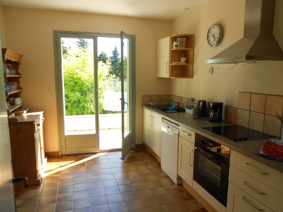 airy kitchen leading out to terrace