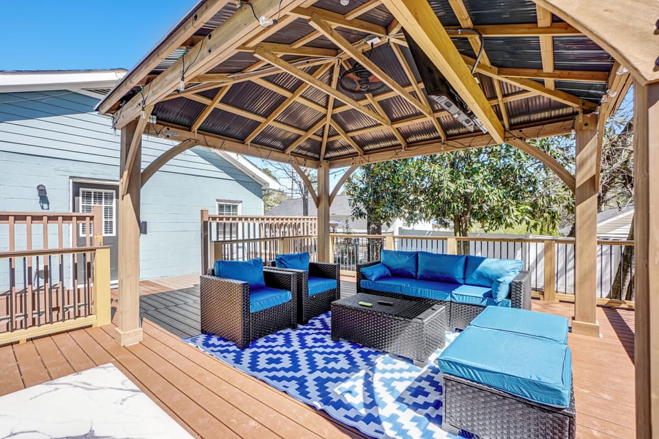 Enjoy the outdoor in style with this specious deck featuring a charming gazebo 