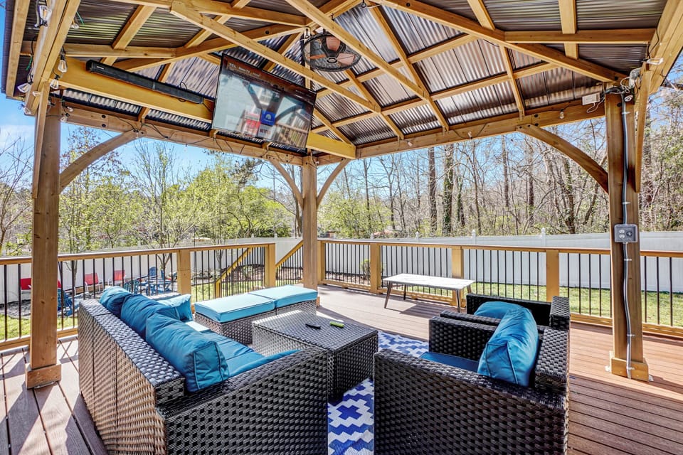 Enjoy the outdoor in style with this specious deck featuring a charming gazebo 