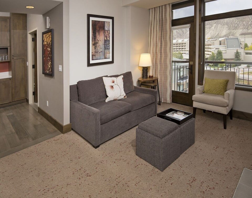 Private balcony with 2 chairs/table and mountain view. Sofa Sleeper