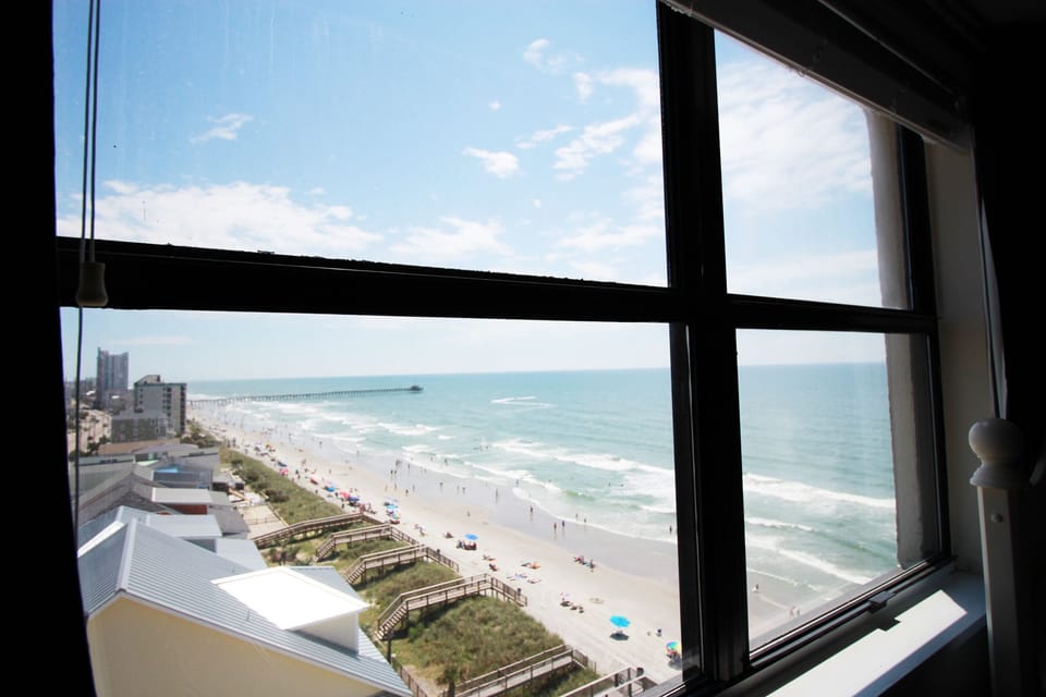 Window in secondary bedroom shows off the gorgeous view of Cherry Grove Pier!
