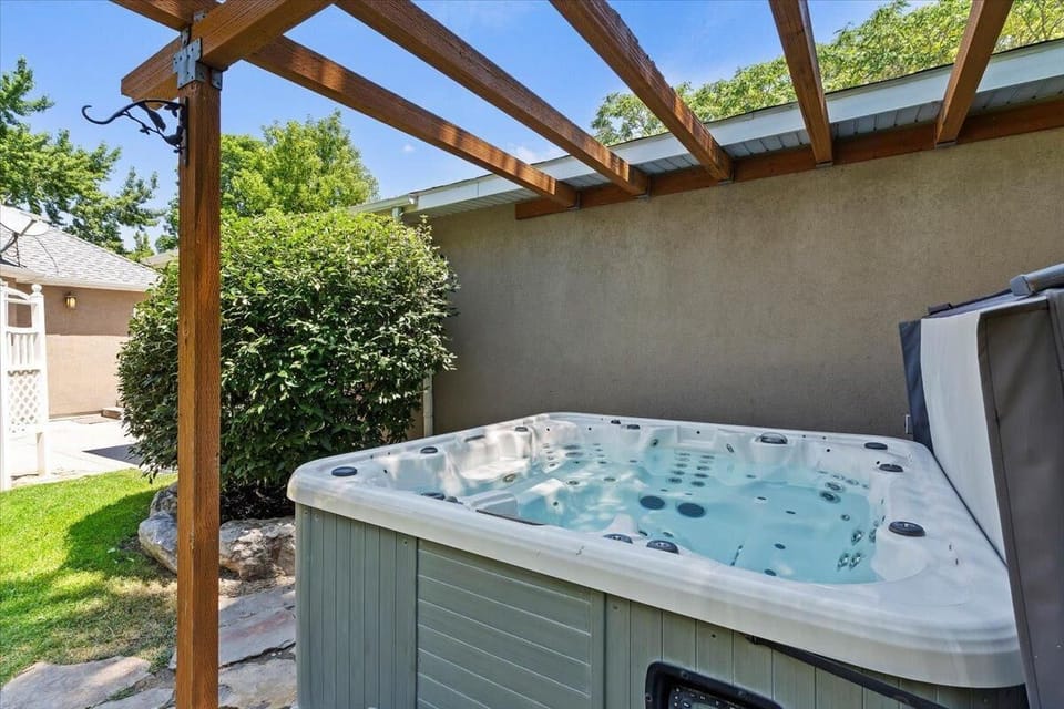 New hot tub under pergola