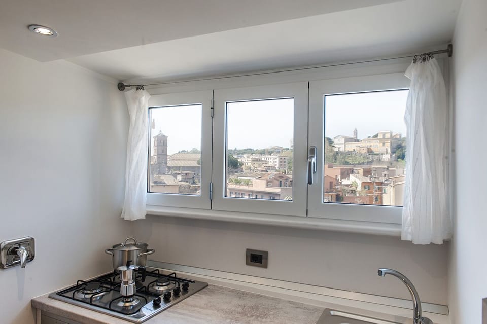 The stove and the panoramic windows over Rome