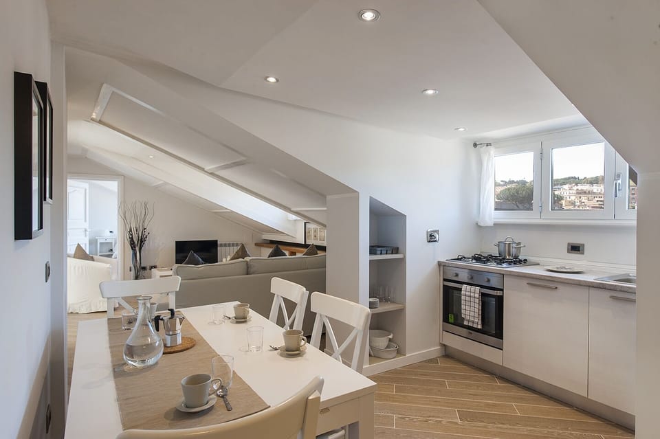 Kitchen and dining area. In the background the living room