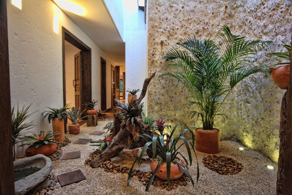 Walk from Bedroom #1 to #2 via our open air private Garden.