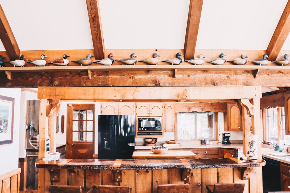 Reclaimed wood from a Scandinavian ship turned breakfast bar, overlooks kitchen 