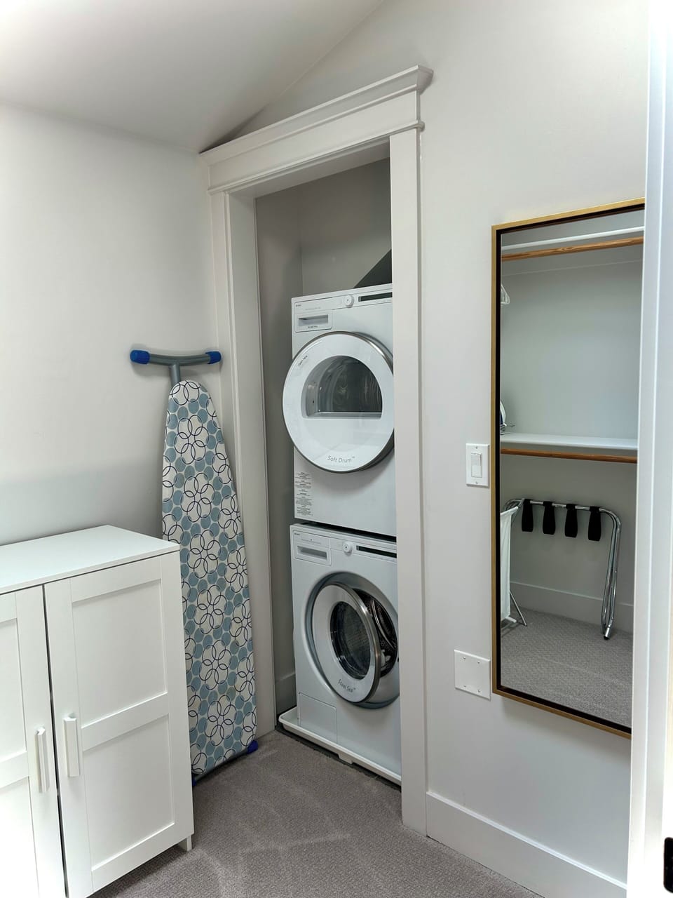 There is a large walk-in closet upstairs with laundry machines. 