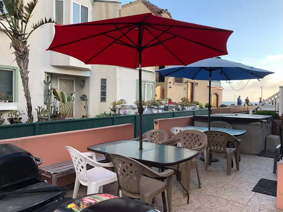 Large patio bbq deck.    Multiple BBQs. Shared area.