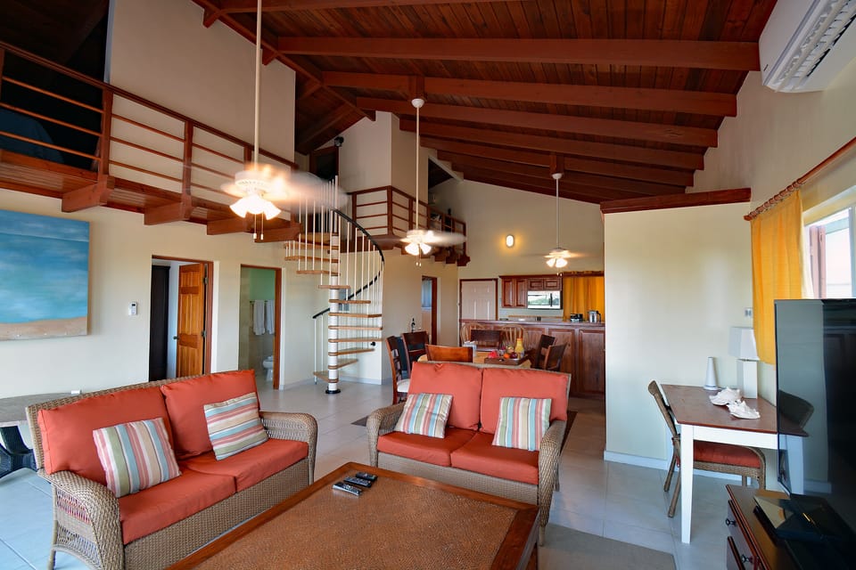 Living and dining areas, with kitchen, and the bedrooms in the backgroun
