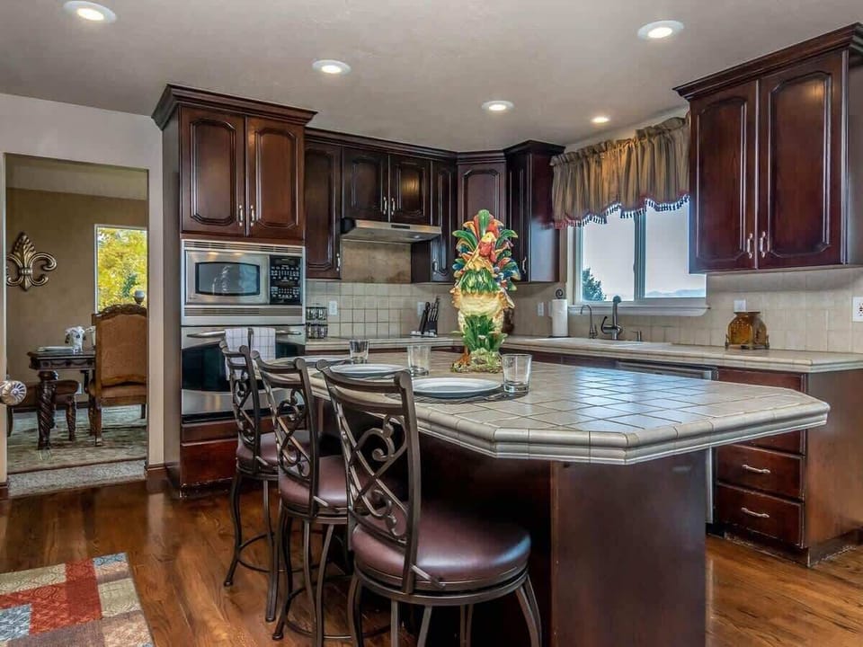 Bar seating for 3 and fully stocked with appliances and utensils