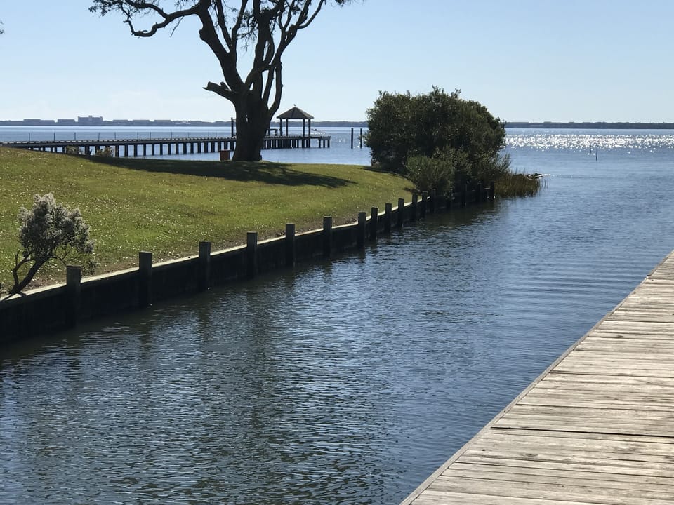 Protected boat basin adjacent to property.  FRESHLY DREDGED JULY 2022!!