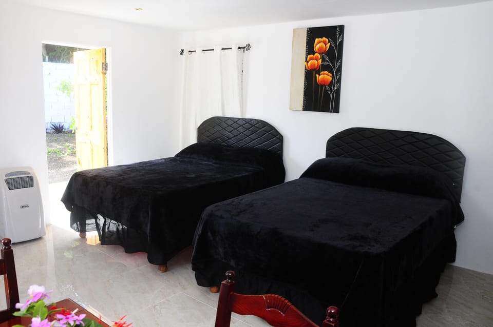 Interior has air con, kitchen, bathroom with cable tv, free wifi music system