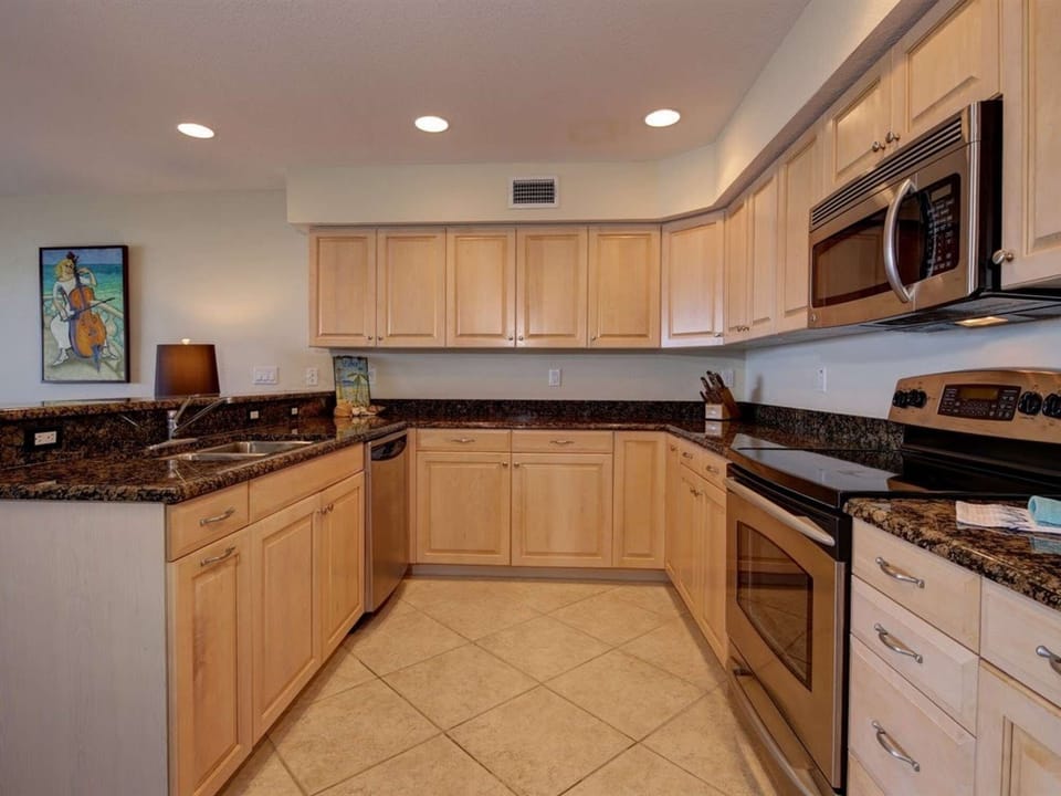 Fully-stocked kitchen with side-by-side refrigerator, microwave, dishwasher, full-size sink, pots and pans, toaster, coffee makers (Keurig and drip), and much more.