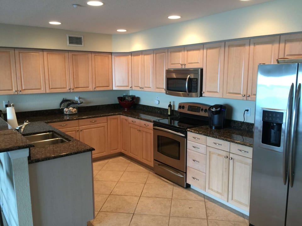 Fully-stocked kitchen with side-by-side refrigerator, microwave, dishwasher, full-size sink, pots and pans, toaster, coffee makers (Keurig and drip), and much more.