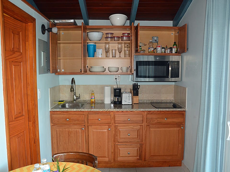 The efficient kitchenette in this studio villa