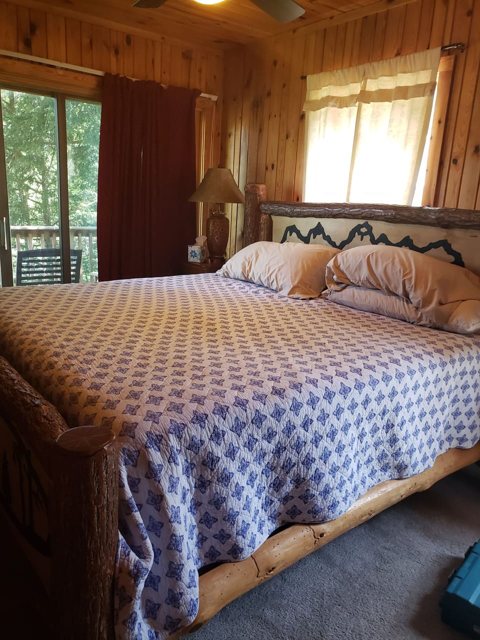 First Floor Master bedroom with deck, log post bed and bath