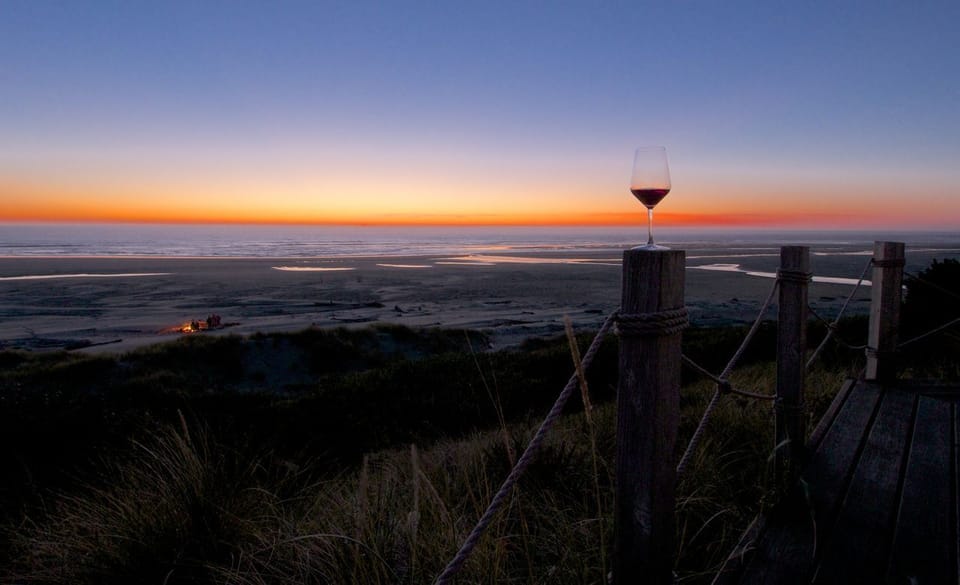 Fire on the beach with fine wine in hand. We provide glassware for every moment