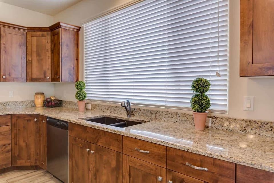 Dishwasher and nice sink with large window gorgeous views