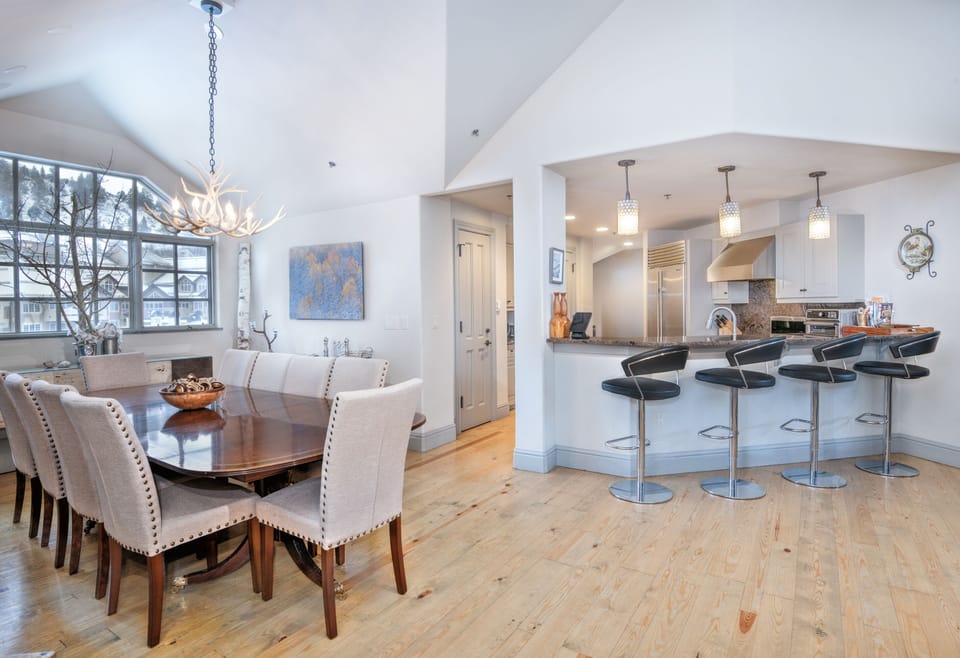 Kitchen bar with seating for 4 people and dining room table w/seating for 10!