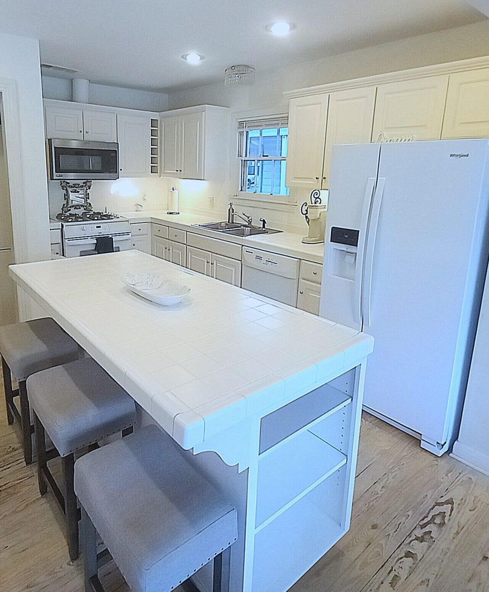 Kitchen island, seating to gather. Enjoy filtered water ice Keurig and drip pot.