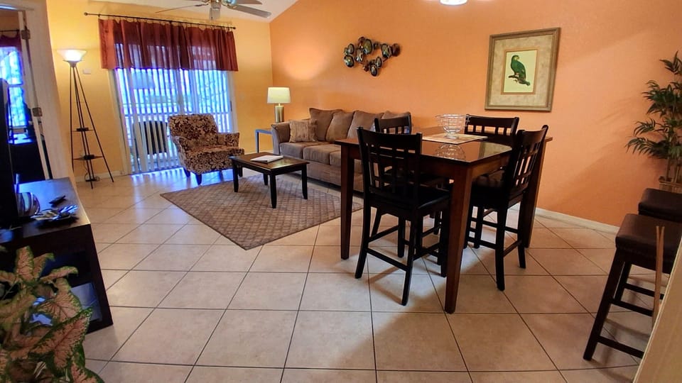 Dining room / living room / screened-in patio access. 