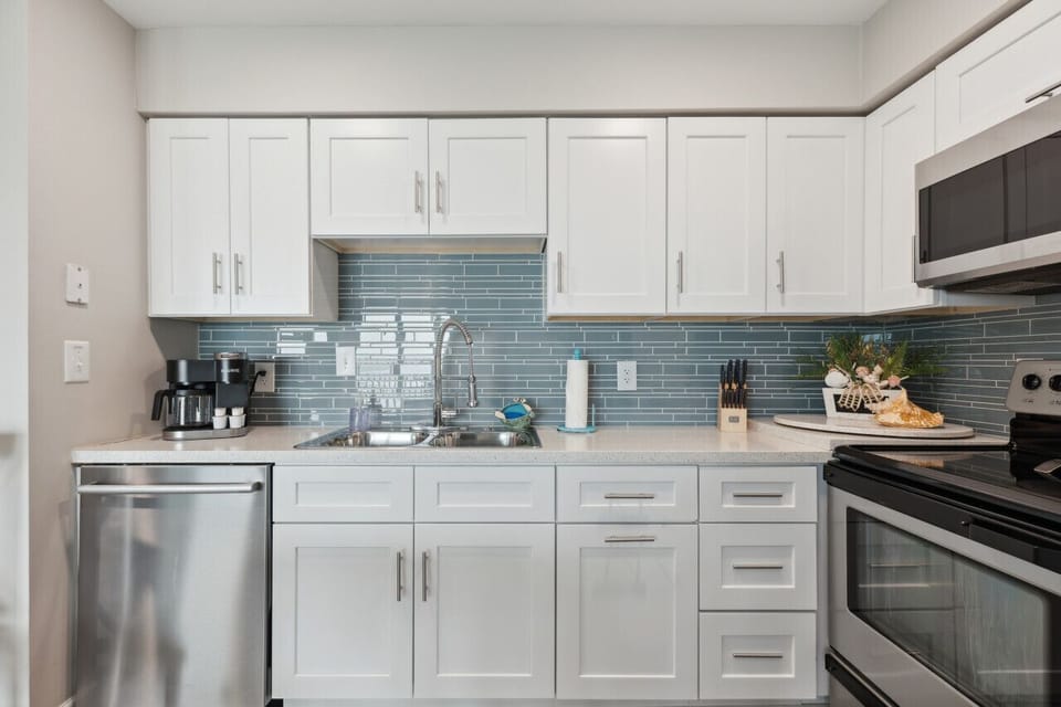 Fully stocked kitchen with stainless steel appliances