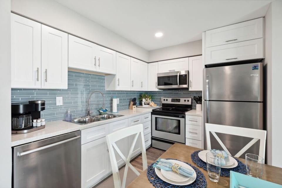Fully stocked kitchen with stainless steel appliances