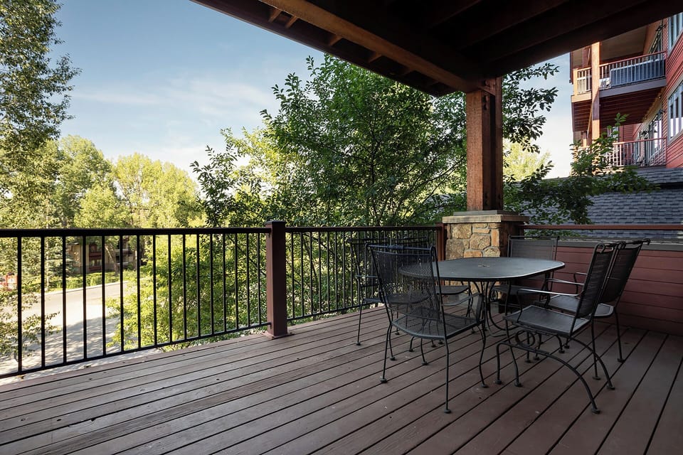 Step onto your private deck where morning coffee tastes better surrounded by leafy views and peaceful outdoor dining.