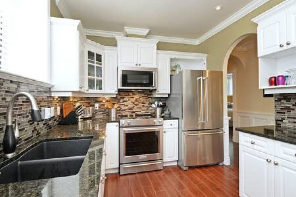Heated tiled floor with top of the line Kitchen appliances
