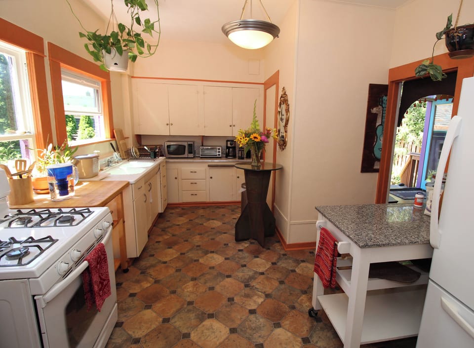 Vintage kitchen charm with complete modern appliances.