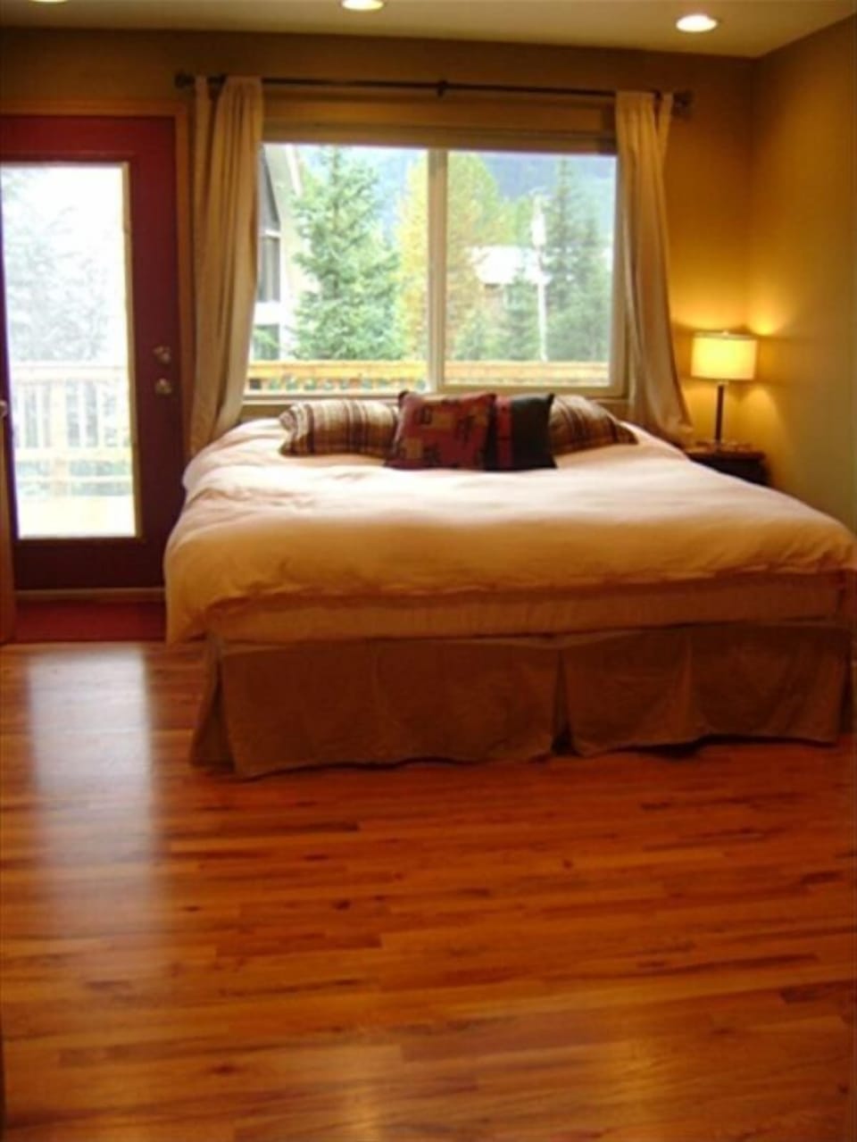 Bedroom with king bed off of large deck 