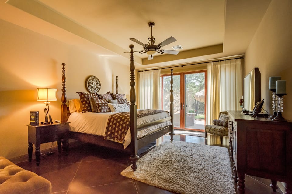 Master bedroom with slider outside to pool area