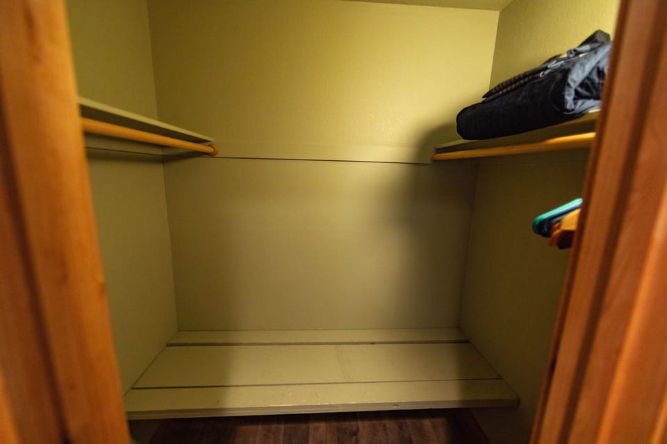 walk in closet with bench
