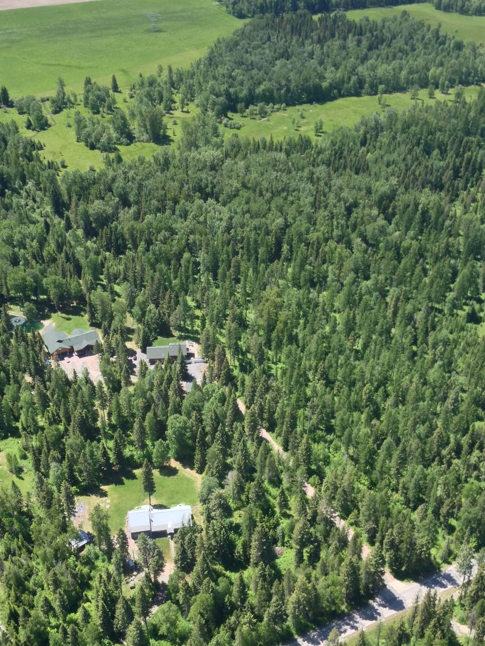 Aerial  view of the two properties in the middle of the photo.