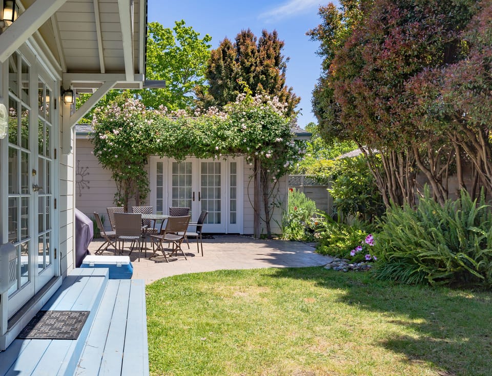 Side yard and patio, facing French doors to master bedroom