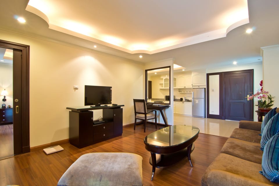 Suite, 1 Bedroom | Living area | 32-inch flat-screen TV with cable channels, TV, DVD player