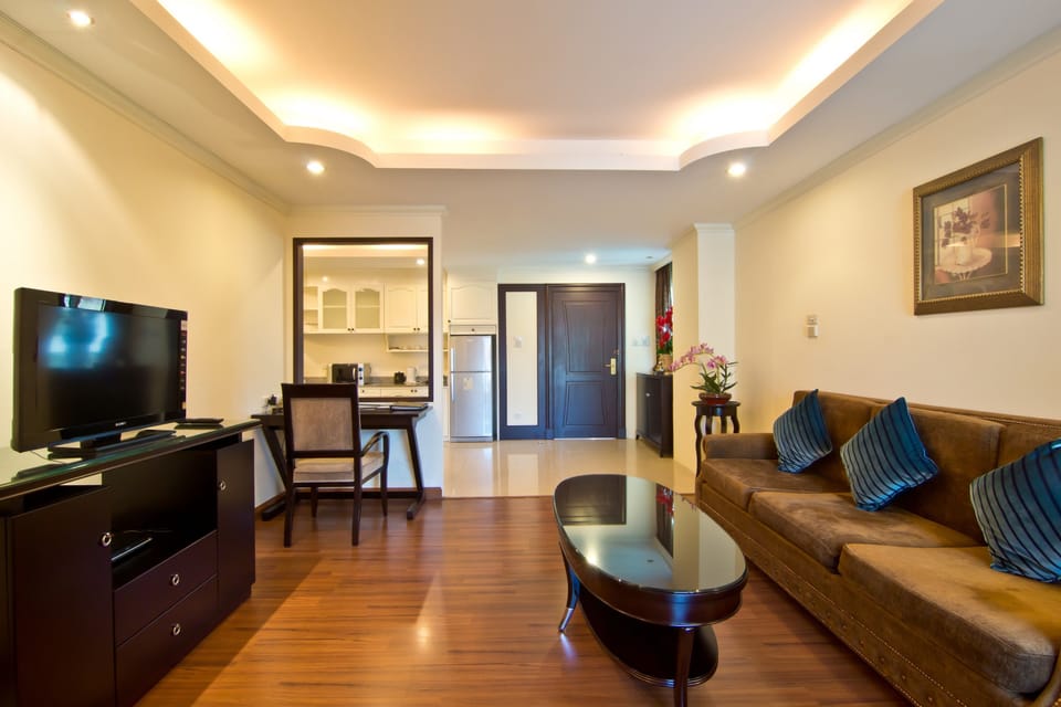 Suite, 1 Bedroom | Living area | 32-inch flat-screen TV with cable channels, TV, DVD player