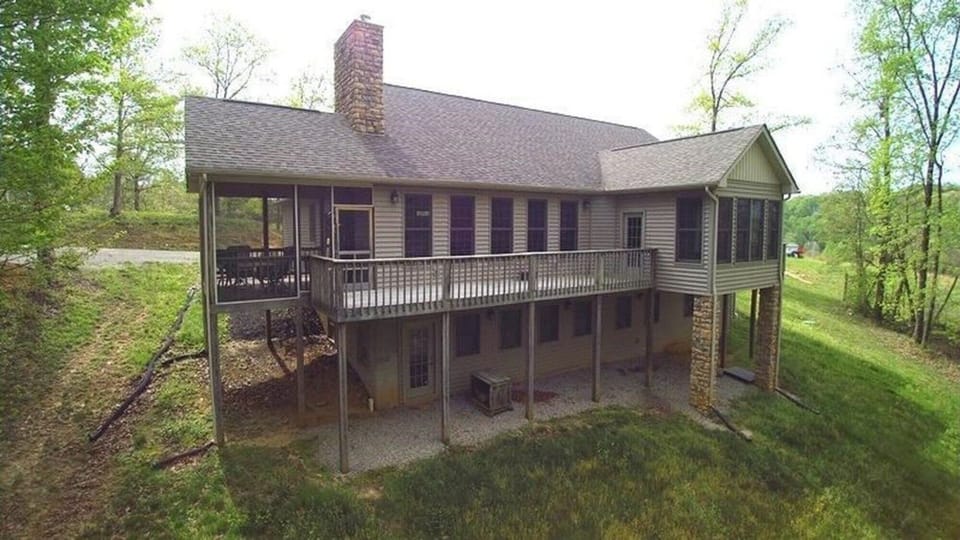 Screened porch and balcony.  View of back of Rocky Pine. 

