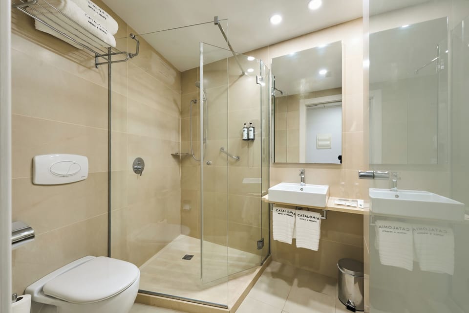 Shower, eco-friendly toiletries, hair dryer, towels